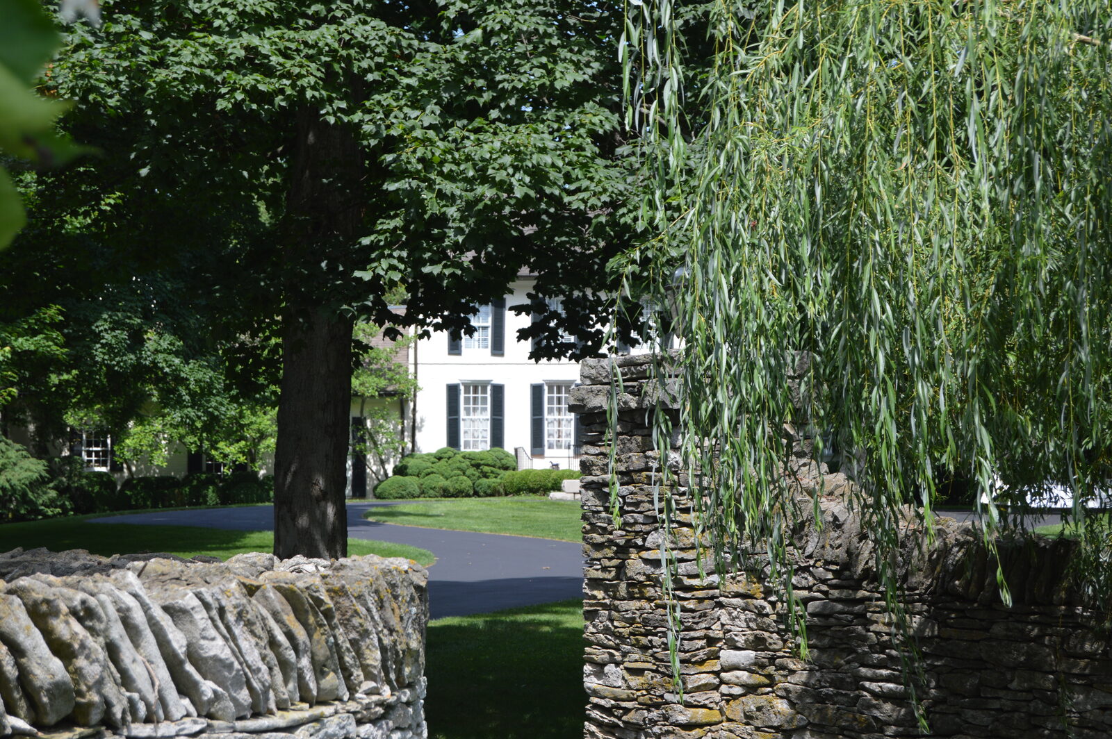 Dry-laid limestone rock fence in front of a Lexington, Kentucky home